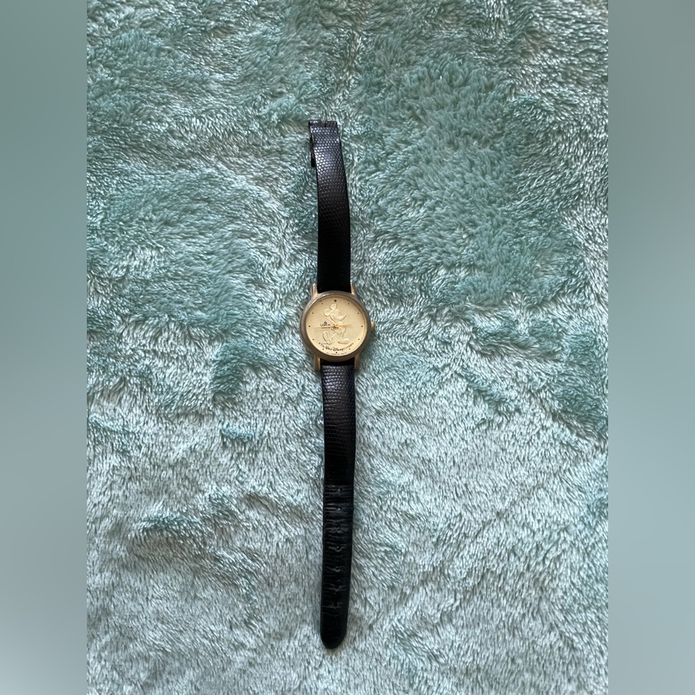 Lorus Disney Mickey Mouse golden and black watch. Shows wear and tear. OS